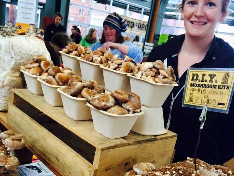 Selling mushrooms at local farmer's market, Courtesy Cascadia Mushrooms