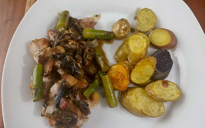 Chicken with Mushrooms, Bacon, and Asparagus served on a plate