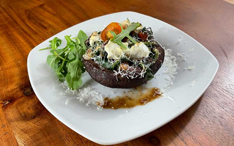 Your Stuffed Portobello mushroom, broiled and ready.