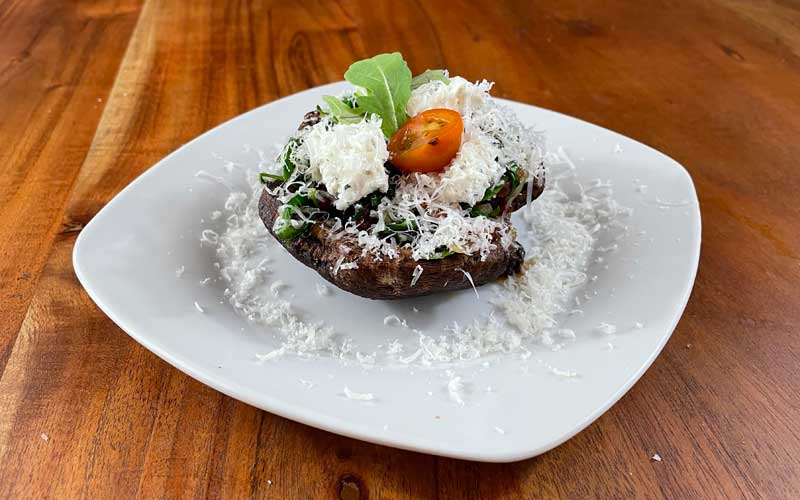 Stuffed Portobello mushroom, ready to broil.
