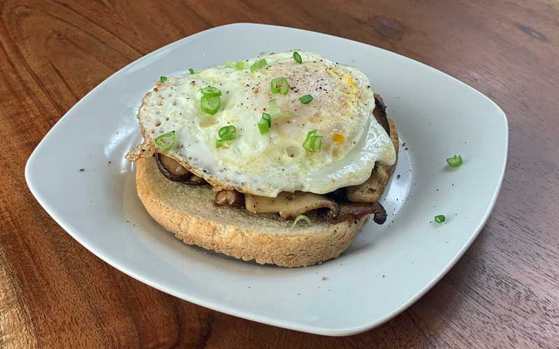 Basque mushroom toast on plate.