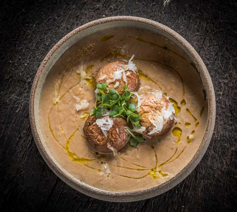 Roasted onion stew with chestnut mushroom, savory, and grated radish.