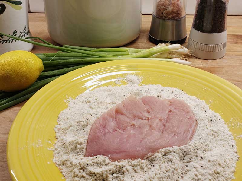 Preparing the chicken for Chicken Scallopini and Shiitake Mushrooms