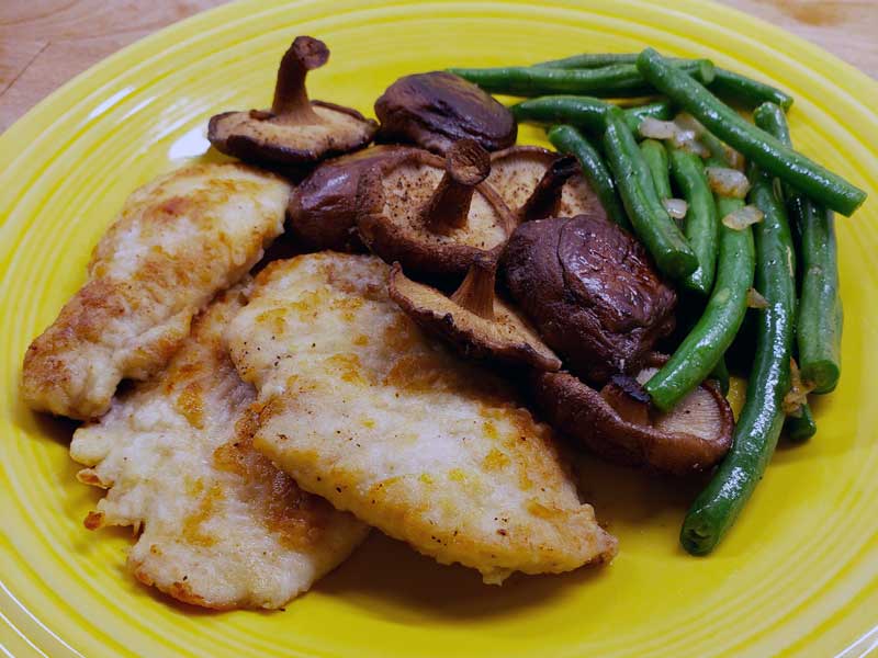 Chicken Scallopini and Roasted Shiitake Mushrooms on plate.