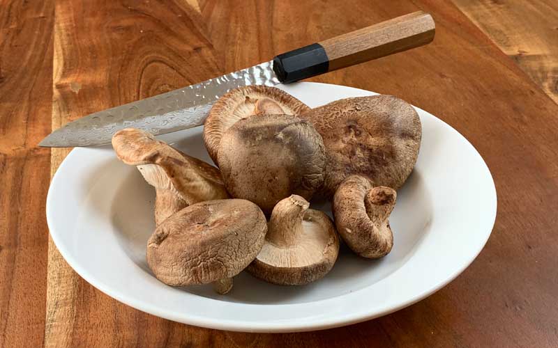 Shiitake mushrooms with knife